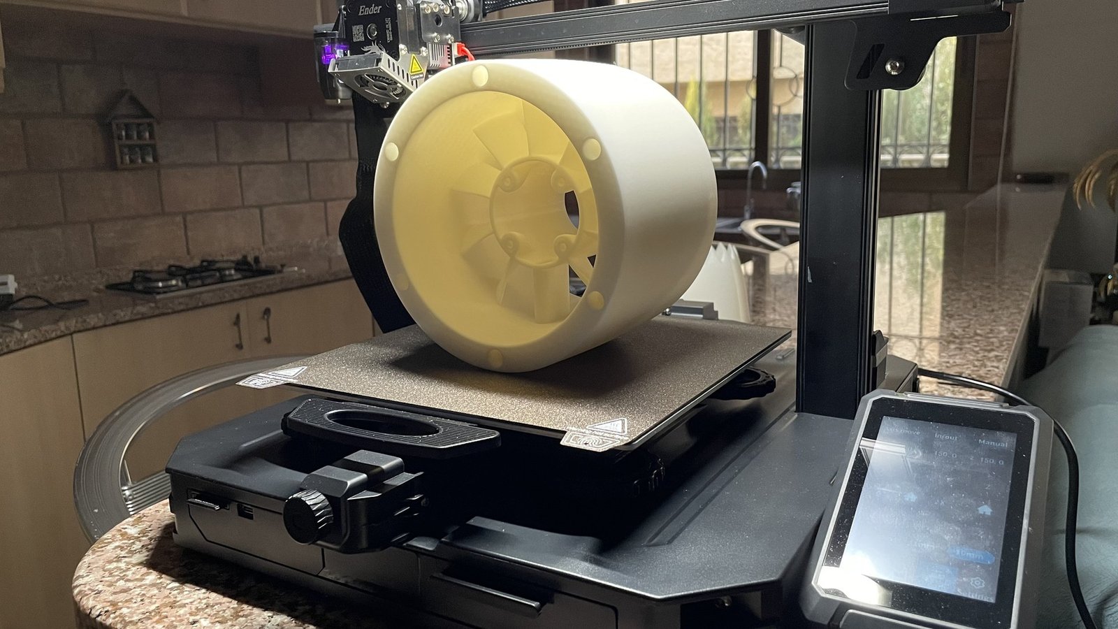A finished white nacelle section on the bed of the Creality Ender-3 S1 Pro.