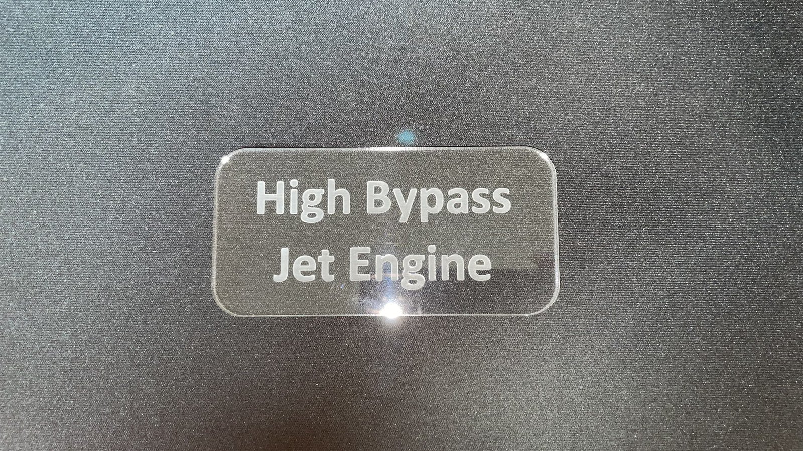 The finished clear acrylic plaque, engraved High Bypass Jet Engine.