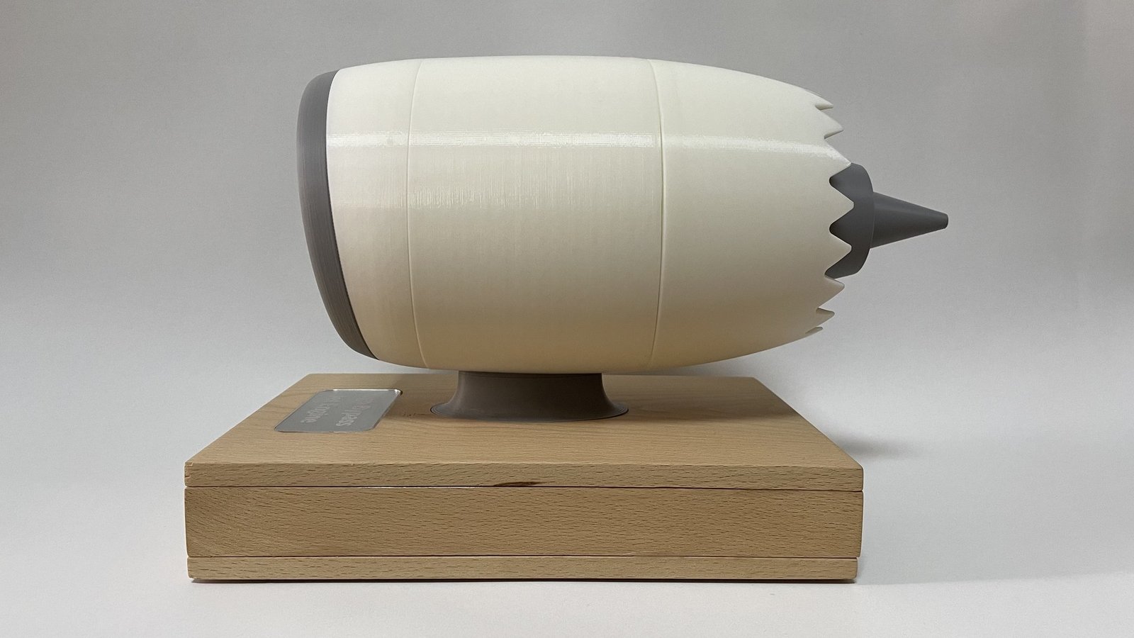 The finished engine in side profile on its wooden base.