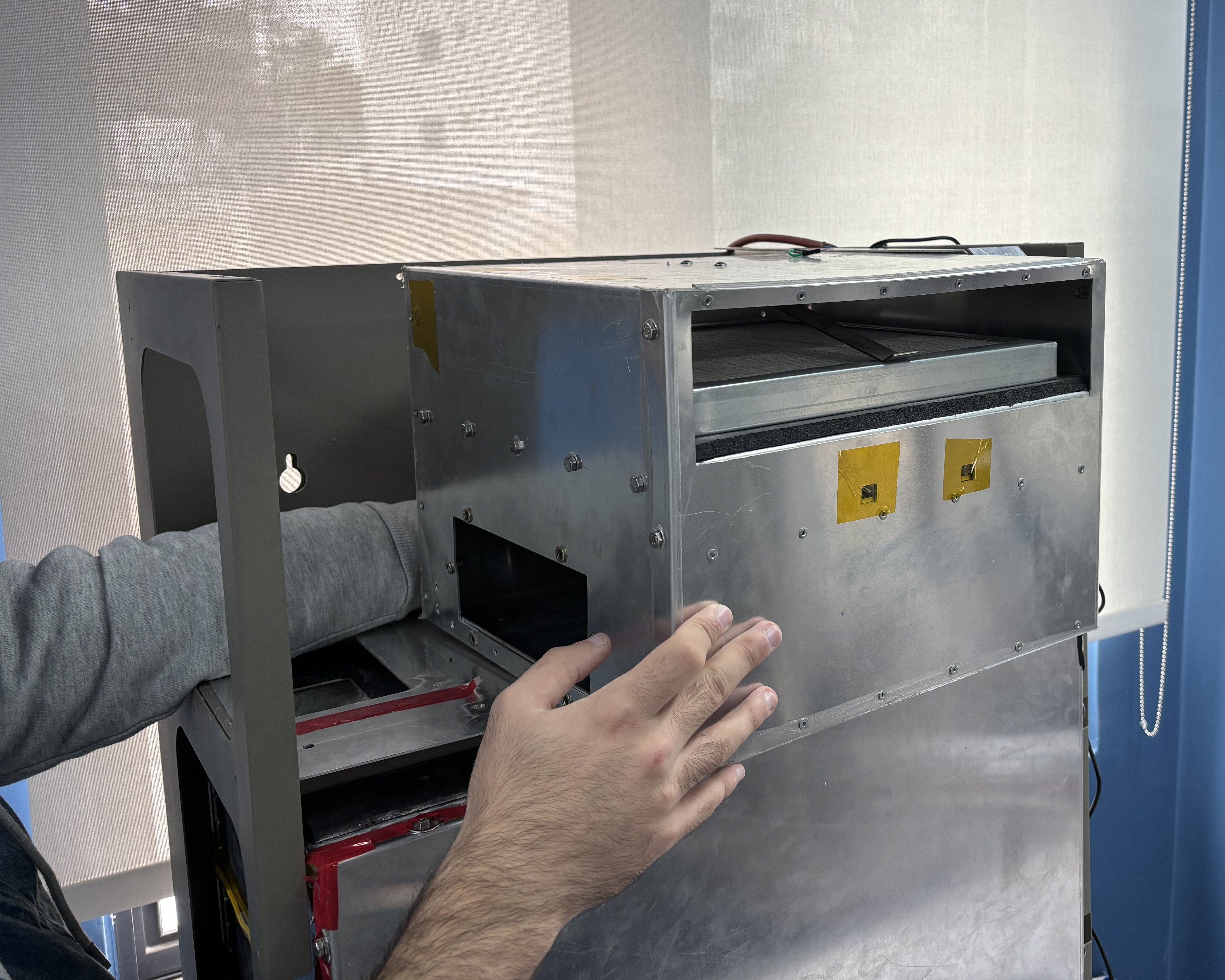 The prototype's sheet-metal enclosure opened up.