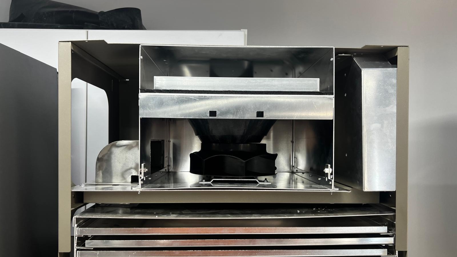 The rebuilt Droplet with its front open, showing the fan, duct, and tray stack.