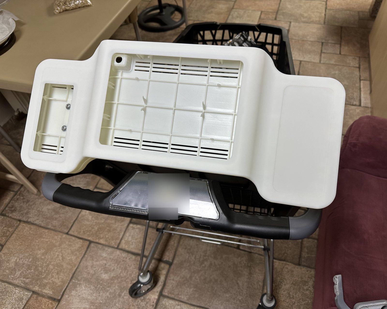 The device mounted on the cart in store, side view.